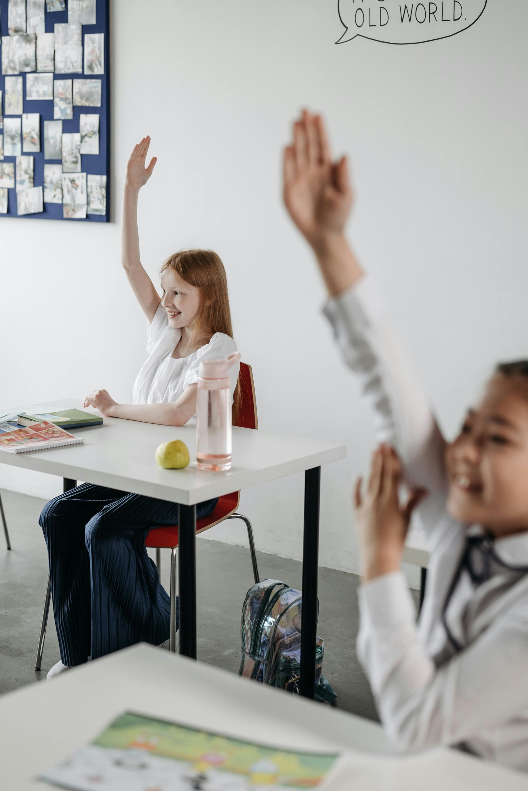 Students actively participating in a classroom setting, engaging with the material.